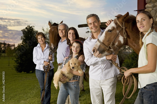 Photo: Three generation family portrait with horses and puppy Three generation family portrait with horses and puppy
