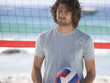 A man playing beach volleyball