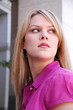 blond business woman looking over her shoulder blond business woman looking over her shoulder