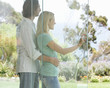 A couple looking at their garden