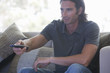 A man using a remote control