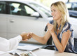 A young woman buying a new car
