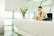 A receptionist sitting at a desk