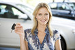 A young women with keys to a new car