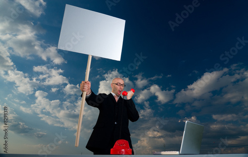 Photo: Man Holding Sign Man Holding Sign