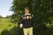 Mid adult man tossing a golf ball