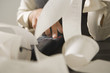 Close-up of a businesswoman's hand calculating on an adding machine