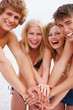 Young men and young women enjoying on beach