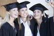 Foto: Three graduates celebrating Three graduates celebrating