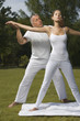 Foto: Yoga instructor teaching yoga to a young woman Yoga instructor teaching yoga to a young woman