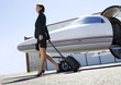 A business woman leaving a plane