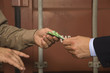 Businessman bribing a dock worker