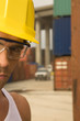 Portrait of a male dock worker wearing a hardhat