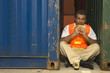 Portrait of a dock worker eating a sandwich