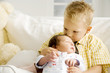 A young boy with his new sibling