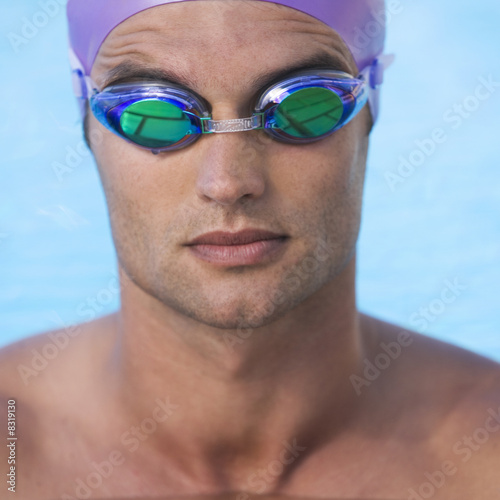 Photo: A young man in a swimming pool A young man in a swimming pool