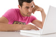 Guy working with modern laptop seated at the desk