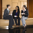Businesswomen drinking coffee.