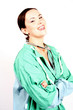 Photo: young attractive laughing doctor in scrubs or a medical young attractive laughing doctor in scrubs or a medical
