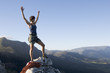 A climber celebrating reaching the top