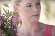 A young woman with a bouquet of flowers, close-up