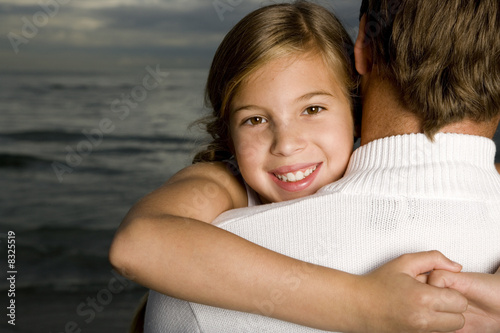 Photo: A father and daughter on a beach A father and daughter on a beach