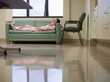Photo: Nurse taking break in hospital staff room, lying on sofa, hands behind head, side view Nurse taking break in hospital staff room, lying on sofa, hands behind head, side view