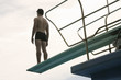A diver standing on a diving board