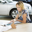 A young woman buying a new car