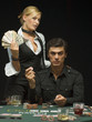 Couple at poker game holding money