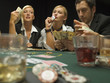 Woman kissing dealer button at poker game
