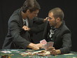 Men fighting at poker game