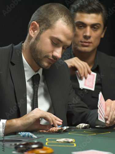 Photo: Men playing poker Men playing poker