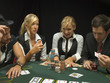 Happy woman winning at poker game
