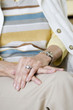 An elderly woman sitting in a chair