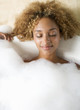 Portrait of a young woman in a bath