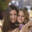Portrait of a mother and her young daughter, close-up