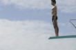 A diver standing on a diving board