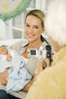 Foto: A grandmother videoing her daughter and new baby A grandmother videoing her daughter and new baby