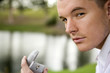 A young man holding an engagement ring