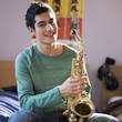 A teenage boy with a saxophone