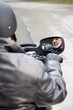 A senior man riding a motorbike