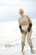 A senior woman on a beach