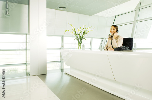 Photo: A receptionist talking on the telephone A receptionist talking on the telephone