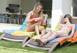 Two teenage girls sunbathing