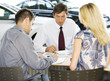 A young couple buying a new car