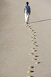 A man walking on a beach