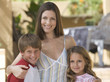 Portrait of a mother with her young son and daughter
