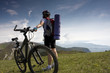 Young lady cycling in the mountains
