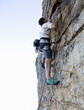 A climber climbing a rock face